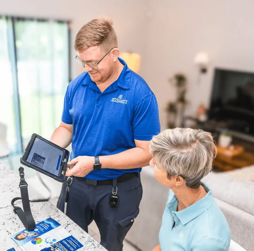 Technician showing options to customer on tablet